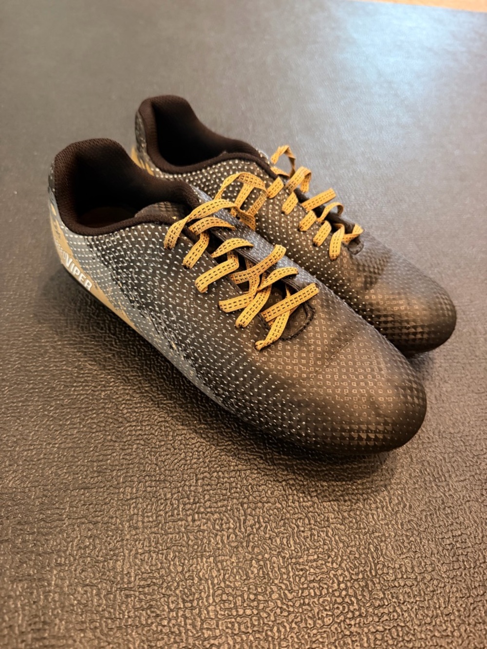 DSG Kids Soccer Cleats Size 4.5 Black and Gold
